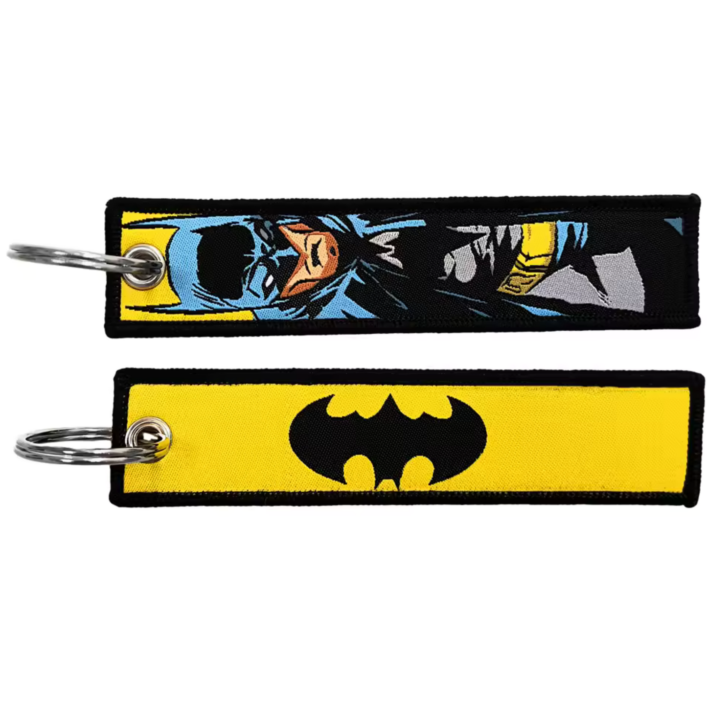 Affiche ton admiration pour le Dark Knight avec ce long porte-clé textile à l’effigie de Batman ! Des deux côtés, retrouve Batman dans son costume emblématique, silhouette imposante et cape flottant dans la nuit, prêt à défendre Gotham avec sa justice implacable. Ce porte-clé robuste et mystérieux est parfait pour personnaliser tes clés, ton sac ou ton rétroviseur, et te rappellera que la lutte contre le crime ne s'arrête jamais, même dans les ténèbres.
