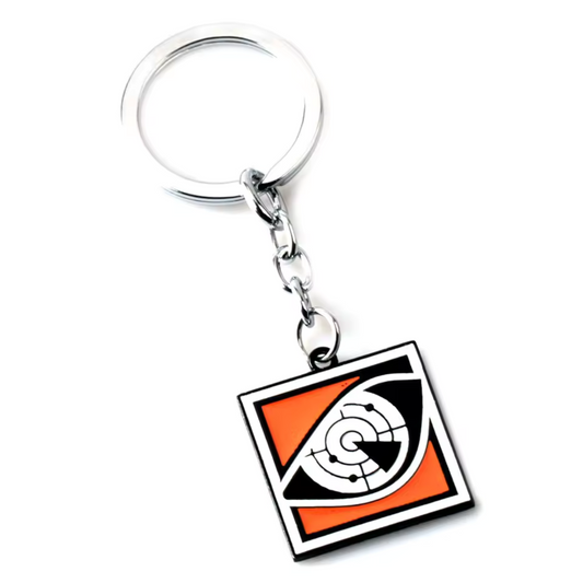Sens les battements du danger avec ce porte-clé Rainbow Six Siege à l’effigie de Pulse, le maître de la détection cardiaque ! Affichant son icône emblématique, ce porte-clé solide et stylé incarne parfaitement l’esprit de cet opérateur américain capable de repérer les ennemis à travers les murs. Accroche-le à tes clés, ton sac ou ton setup gaming pour montrer ton flair pour la détection et l’anticipation. L’accessoire parfait pour les joueurs qui aiment garder une longueur d’avance sur R6S !